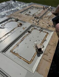 Historic paint being stripped from the Craigmyle door panels