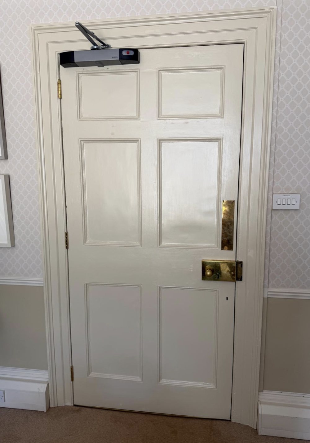 Craigmyle door rehung in situ with overhead closer and brass furniture